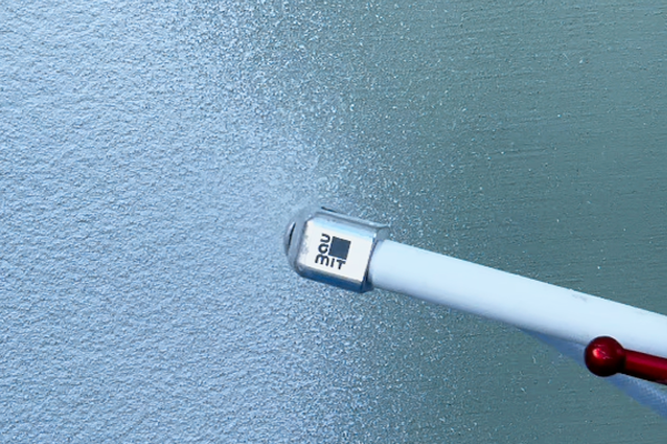 Nanášanie omietky Baumit SilikonTop Master striekaním Nanášanie omietky Baumit SilikonTop Master striekaním